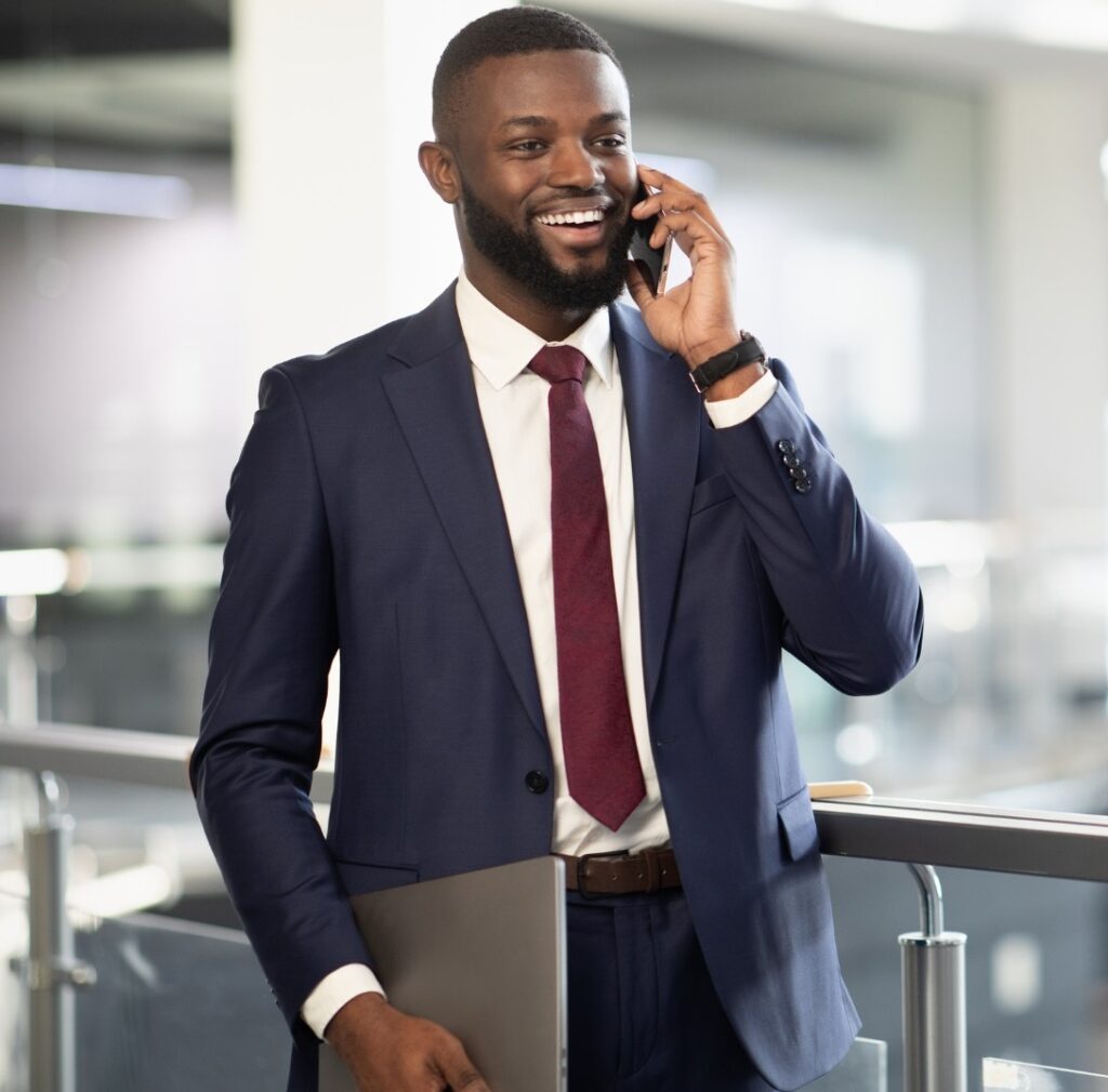 A young corporate worker excited on a phone call